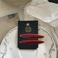 Detail of dark red glitter hair clips on a handmade card over a white vintage plate - Willow Leaf Style (J5.2-Willow Leaf) / Red Gold Glitter Pair