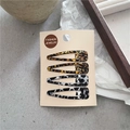 Lot de quatre barrettes à cheveux motifs léopard et marbre sur carte de support - Taches et Léopard Jaune