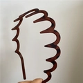 Detail of tortoise shell headband with non-slip wavy teeth design for hair grip - Wide with Teeth (Brown Leopard)