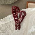 Detail of dark red resin hair claw with heart cutout and golden scripted text accents - Hollow Heart Style (C5.4) / Dark Red