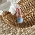 Detail of wool felt hair clip with pink ring and blue ball in a woven basket - Pink Clip (Light Blue Ball)