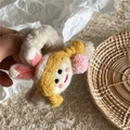 Close-up of cute plush bunny ear hair clip with yellow braids and soft wool felt details - Rabbit Ears (Girl Claw Clip)