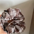 Close-up of retro plaid fabric scrunchie with brown and beige checkered patterns - Grey Brown Plaid Scrunchie
