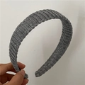 Detail shot of the vertical knit texture on a dark grey wool headband for women - Thin Wool / Light Gray