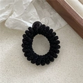 Vue détaillée de l'élastique à cheveux spirale noir tissé avec une perle en résine - Peluche Perlée / Noir