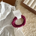 Detailed view of dark burgundy velvet scrunchie with vertical texture and nice day tag - Thin Pleated Hair Tie / Purple