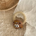 Detail of wool felt cartoon cheese pizza hair tie with unique spiral elastic cord - Bitten Cookie / Khaki