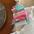 Detail van elastische haarelastiekjes in roze en muntgroen in heldere geschenkdozen - Kleine Ringen in Doos / Blauw Groen Bruine Beer Stijl