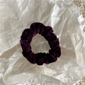 Detailed view of the dark purple velvet scrunchie with a soft ribbed texture - Deep purple