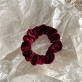 Detailed view of plush burgundy velvet scrunchie showing soft texture and rich sheen - Burgundy