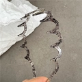 Close-up of wavy toothed resin headband with black ink marble texture detail - Transparent Gray Lines