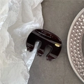 Detailed close-up of a dark brown glossy hair claw clip with golden handmade plaque - Dark Coffee