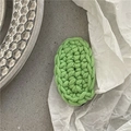 Close-up of grass green hand-crocheted oval hair clip on a minimalist gray background - Oval Knitted BB Clip / Light Green