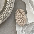 Detail of cream oval knitted hair clip made of thick cotton yarn on a modern stone tray - Oval Knitted BB Clip / Off White