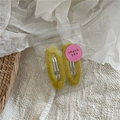 Detail of two ginger yellow plush snap hair clips in transparent thank you packaging - Yellow