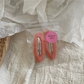 Detail of soft cream peach faux fur hair clips in a gift package with thank you sticker - Orange