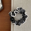 Detail of floral scrunchie with white wavy edges and a glossy black decorative bead - Black Floral with Black Bead and Black Edge