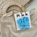 Detail of sky blue high-elasticity seamless hair ties in transparent packaging - Blue
