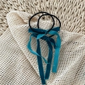 Close-up of peacock blue velvet bow scrunchies with long ribbons on straw background - Peacock Blue