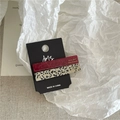 Close-up of rectangle acetate hair clips in wine red and classic leopard print patterns - 2PCS / Red + White