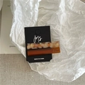Detail view of two geometric acetate hair clips in amber and marble patterns on card - 2PCS / Brown White + Brown