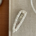 Elegant silver hair clip featuring graduated white faux pearls on a beige linen surface - BB Clips / Water Drop Style (D6.3)
