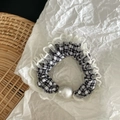 Detail of houndstooth scrunchie with lace edge and a large pearl on white paper - Black White Plaid (White Pearl Small Scrunchie)