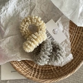 Detailed view of cream and grey-blue pleated mesh scrunchies on a woven tray - Mesh Hair Tie / Gray And Beige