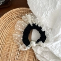 Close-up of mesh polka dot scrunchie featuring a large pearl and layered lace ruffles - White Small Polka Dot With Artificial Pearl