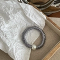 Detail of grey satin hair scrunchie with large faux pearl on a wooden tray with paper - Gray Blue Thin Style (With Pearl)