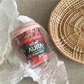 Close-up of colorful fruit tea themed elastic rubber bands in a clear cup with pink lid - Fruit New Jar / Pink
