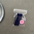 Detail of two dark blue rectangle resin hair clips in packaging with a thank you sticker - Navy Blue
