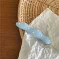 Close-up of wavy blue hair clip with yellow polka dots on a stylish textured background - Blue (Fat Wave)