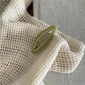 Detail shot of green acetate oval hair clip with sparkling rhinestones and metal backing - Light Yellow Green