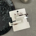 Dettaglio di fermagli per capelli rettangolari in metallo argento su cartoncino su grigio - Argento Rettangolare (Coppia)