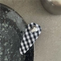Detail of black and white checkered fabric hair clip with a silver metallic heart charm - Small Diamond Grid Style (F6.4 Small Grid)