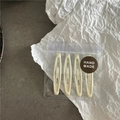 Lot de quatre barrettes ovales crème mat présentées dans un emballage de style artisanal - Pack de 4 / Blanc