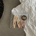 Lot de quatre barrettes mates évidées tons abricot et café dans leur pochette faite main - Pack de 4 / Café Clair Et Abricot