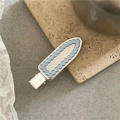 Detail of scalloped light blue hair clip with mirror silver inlay on stone surface - Blue Water Drop