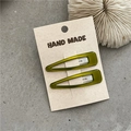 Close-up of olive green resin hair clips on a card, minimalist rectangle hair jewelry - Golden Yellow Water Drop