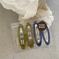 Set of 4 resin hair clips in blue and green colors shown in clear handmade packaging - Blue and Yellow Oval