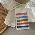 Detailed view of 20pcs cream colored wave hairpins set on white display cards - 20 Pieces Set / Coffee Orange Assorted