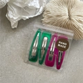 Detailed set of four colorful resin hair clips in vibrant green and magenta with gift bag - Rose Red And Green