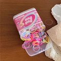 Close-up of colorful TPU elastic hair ties in a transparent jar with kids' branding - Light Rose Red