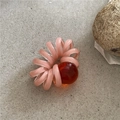 Detail of pink translucent spiral hair tie with a deep red polished resin bead - Pink Phone Cord (Orange Bead)