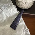Detailed close-up of navy plaid fabric hair clip featuring classic British triangle design - Small Triangle Style (D1.1) / Navy Plaid