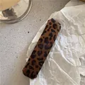 Detail of a rectangular leopard print plush hair clip on a white textured background - Rectangle (Leopard Print)