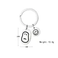 Detail view of smiley face stainless steel charms on a keychain weighing 10.4g - Winter Melon Smile Face (5115282422527)
