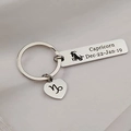 Polished stainless steel Capricorn zodiac keychain with rectangular tag and heart charm - Capricorn