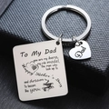 Macro shot of stainless steel Father's Day keychain with 'To My Dad' text on a black box - To My Dad Heart & Coffee Cup Decor (I)